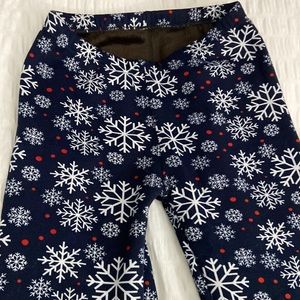 Cozy fleece lined winter leggings.  Snowflake motif.  Super cozy and warm.